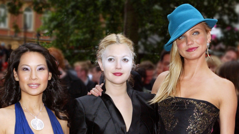 Lucy Liu, Drew Barrymore, and Cameron Diaz posing together