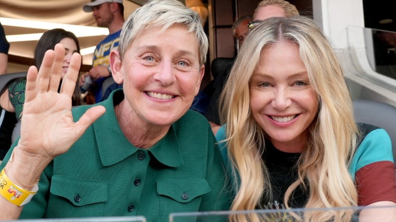Ellen DeGeneres and Portia de Rossi smile at the Super Bowl