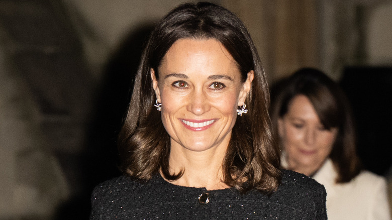 Pippa Middleton with a lob while wearing a dark coat