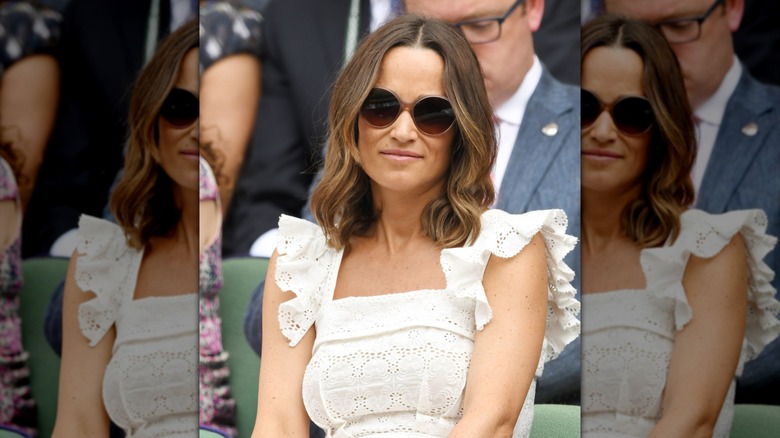 Pippa Middleton wearing a white dress with a wavy lob and sunglasses