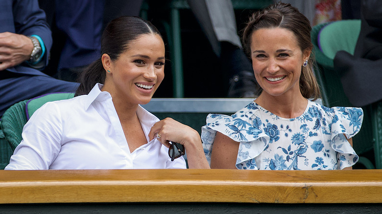 Meghan Markle and Pippa Middleton talking at Wimbledon