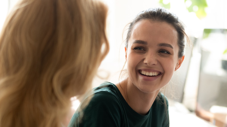 Women having happy conversation