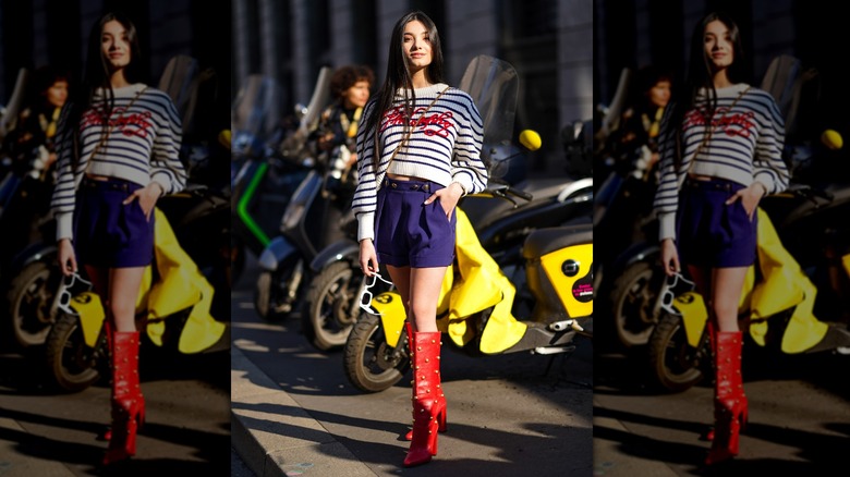 woman wearing pleated shorts