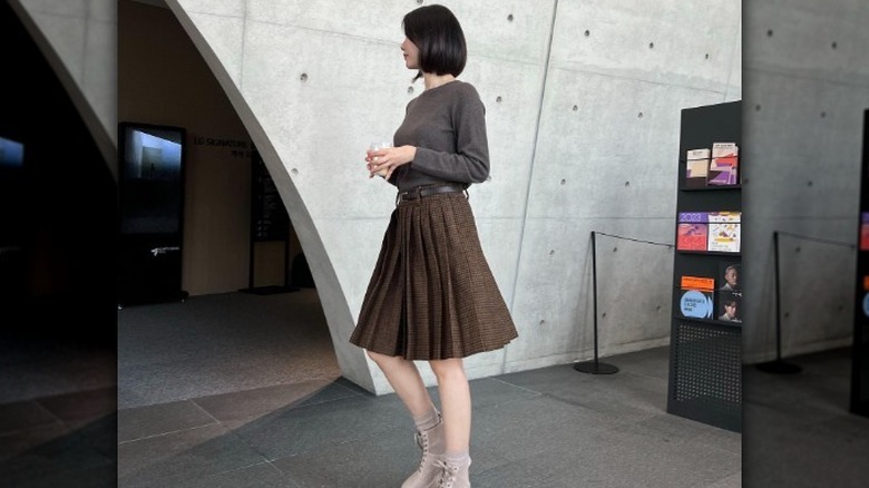 Woman in brown outfit 