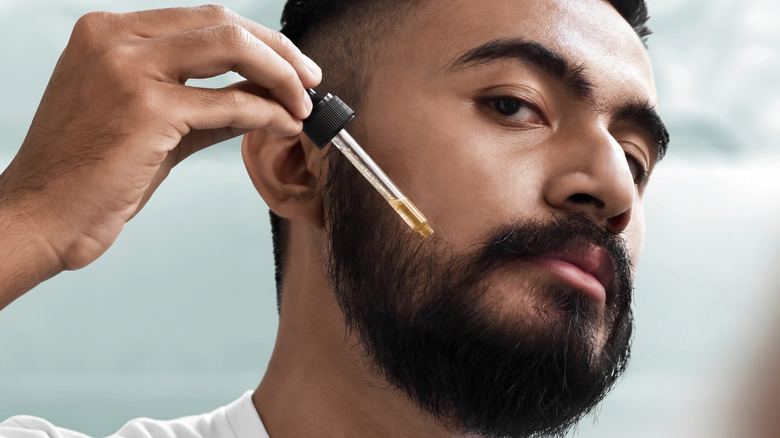 Man using face oil