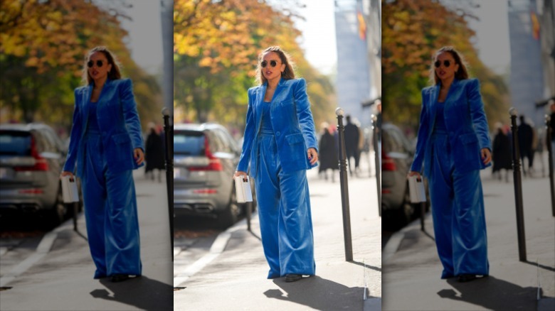 woman wearing blue velvet suit and pants