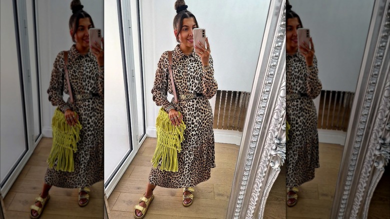 Woman wearing belted animal-print dress