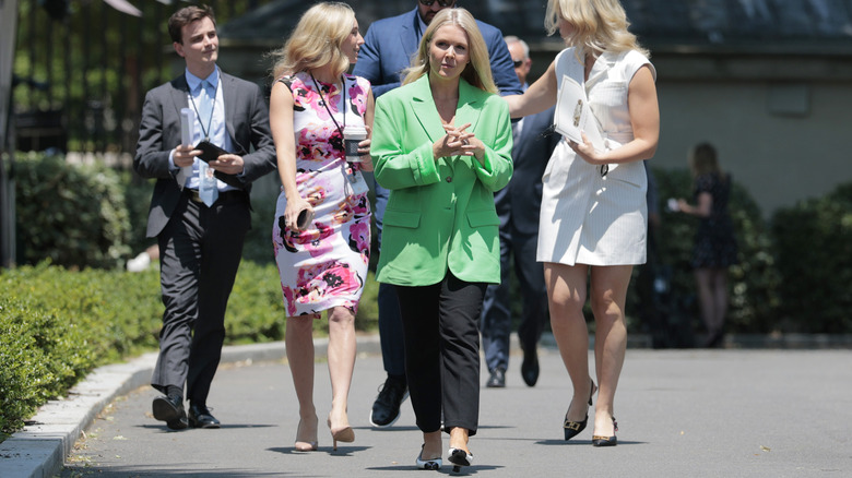 Karoline Leavitt walking outside the White House