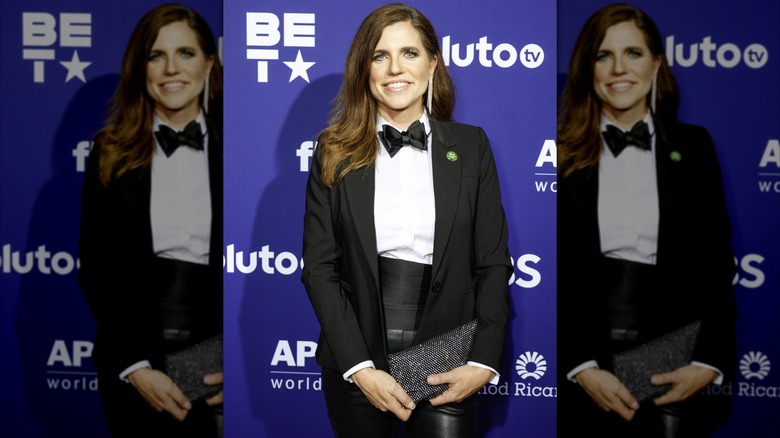 Nancy Mace smiles while wearing a tuxedo pantsuit to the White House Correspondent's Dinner