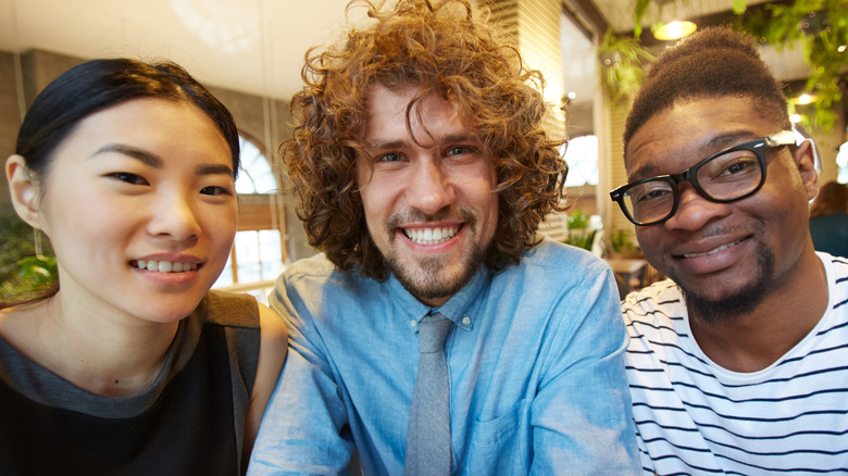 two men and one woman