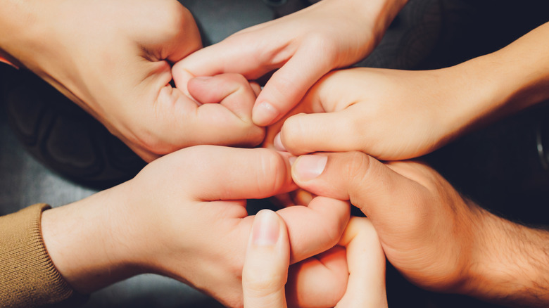 multiple sets of hands