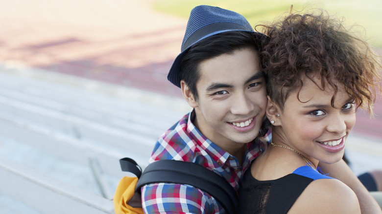 Couple smiling on bench