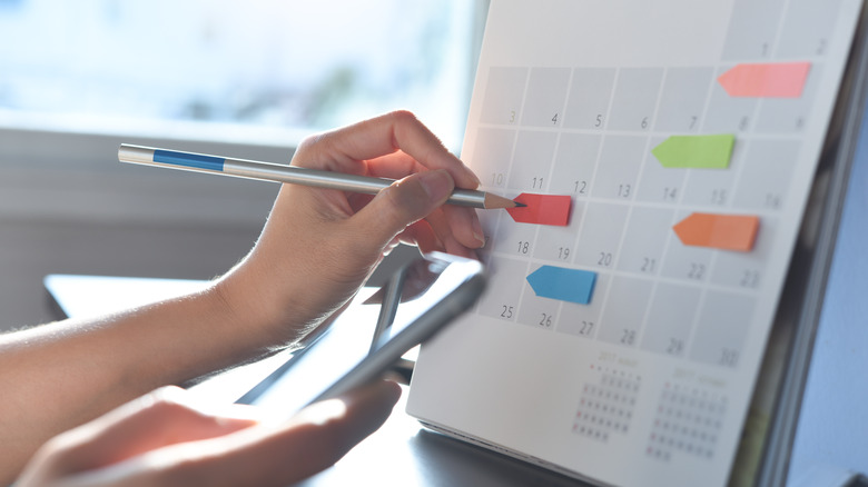 business woman checking planner 