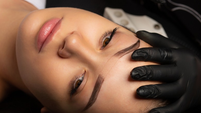 woman preparing for semi-permanent makeup