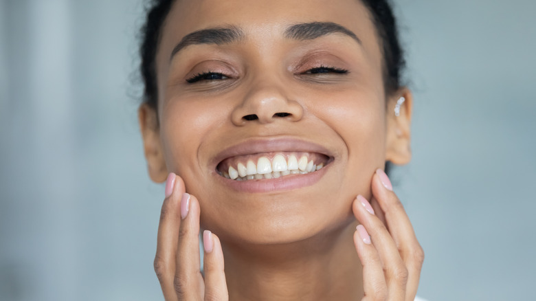 woman showing off radiant skin