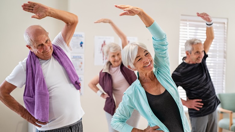 Group exercise class doing stretches