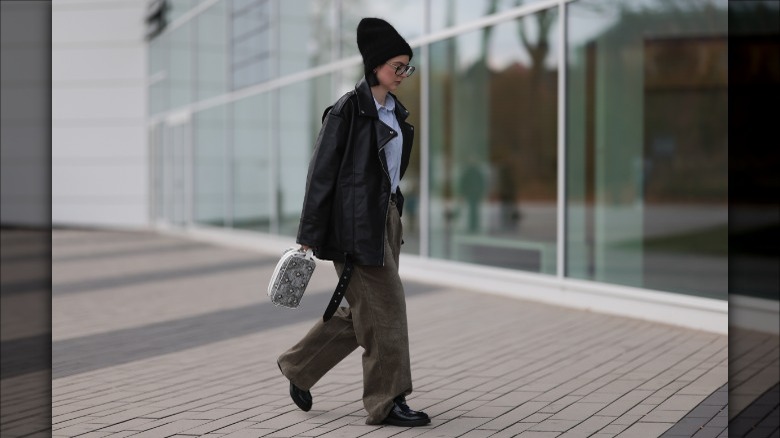 woman black loafers leather jacket