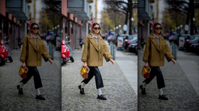 Black loafers yellow purse