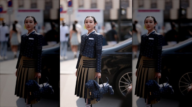 woman with pleated midi skirt