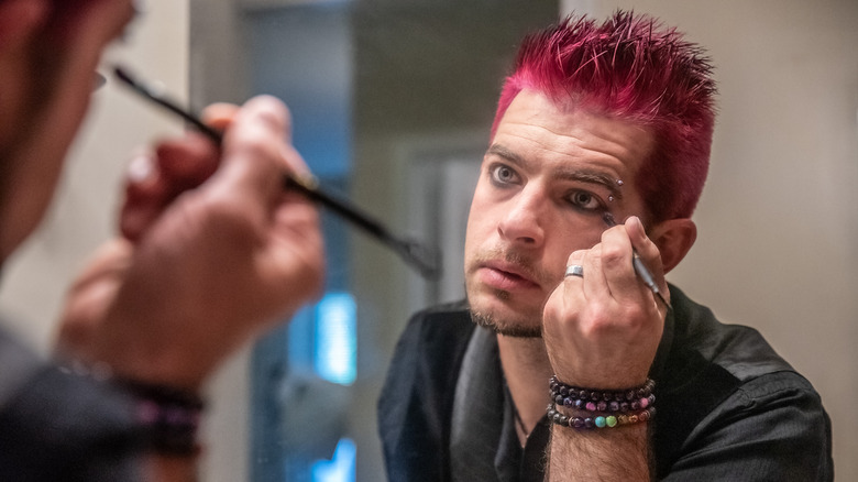 applying makeup on eye