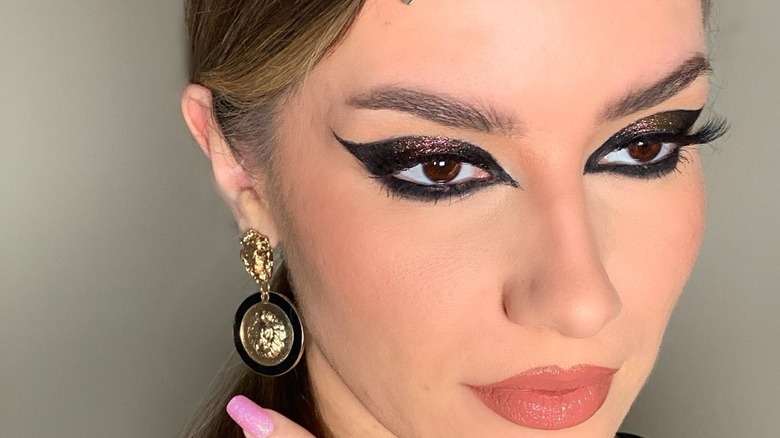 woman with metallic cat eyeliner