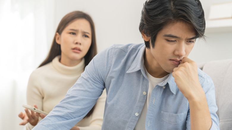 Upset woman with partner