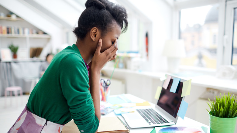 Stressed woman at desk