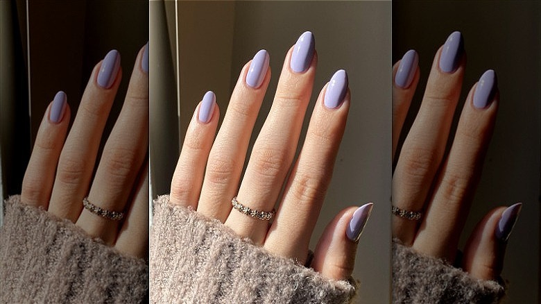 woman hand light lilac manicure