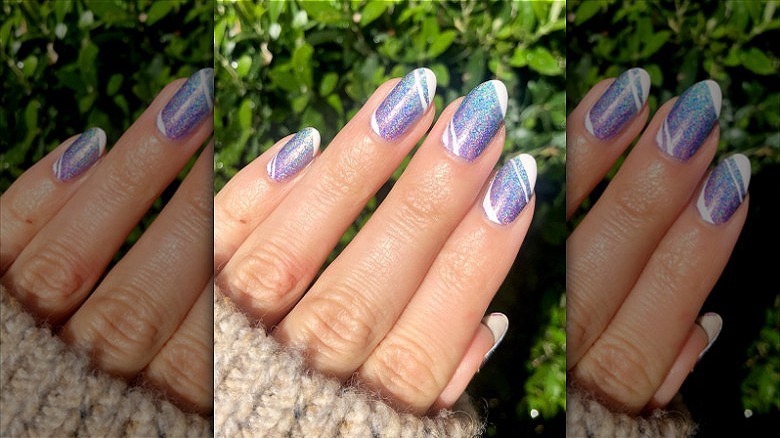 woman's hand holographic purple manicure