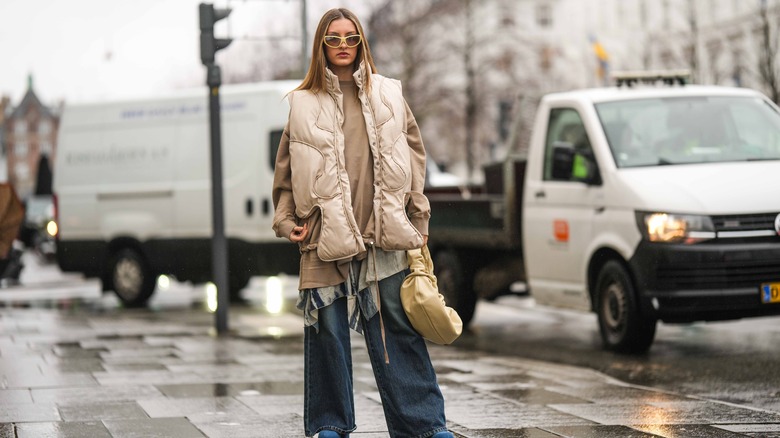 woman wearing sleeveless quilted jacket