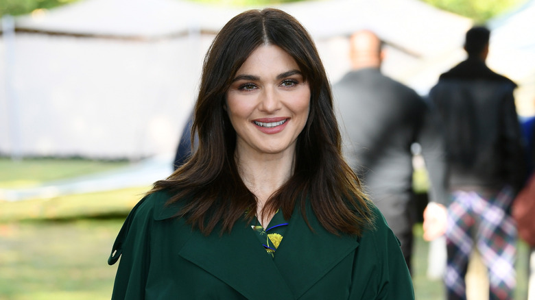 Rachel Weisz wearing a green coat