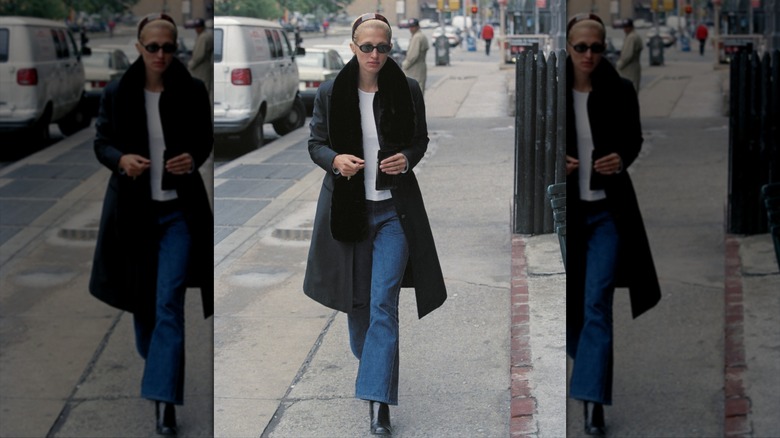 Carolyn Kennedy walking in New York in a classic jeans and trench 'fit