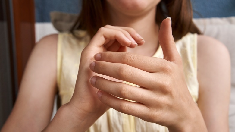 Woman tapping on hands
