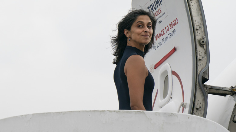 Usha Vance boarding her private plane in a black tank top
