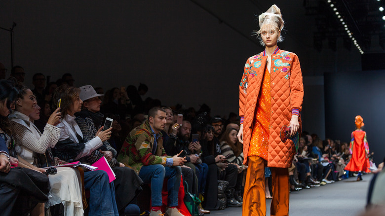 model walking down runway