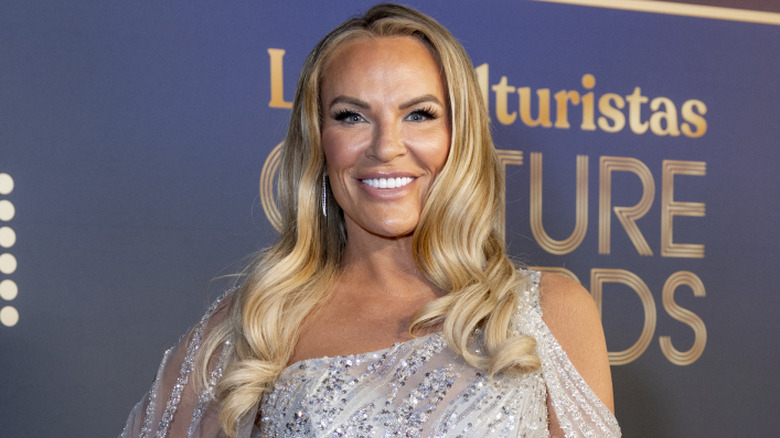 Heather Gay posing in a silver dress