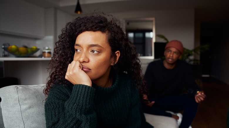 couple arguing on a couch