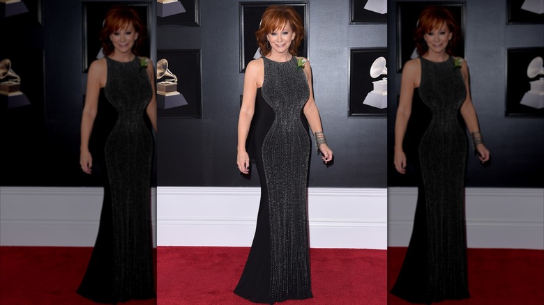 Reba McEntire on the 2018 Grammy Awards red carpet in a black dress with metallic.