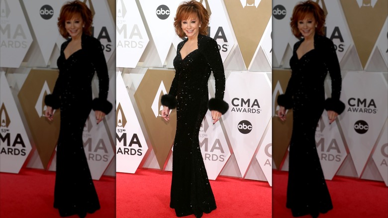 Reba McEntire on the 2019 CMA Awards red carpet in a black dress.