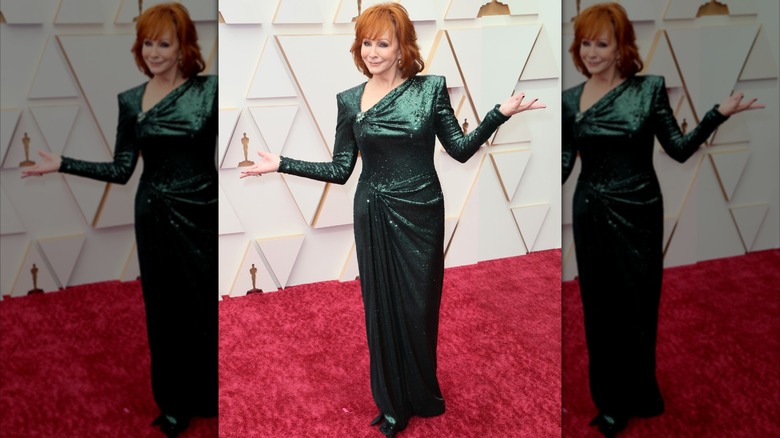 Reba McEntire on the 2022 Academy Awards red carpet in a silver sequin dress.