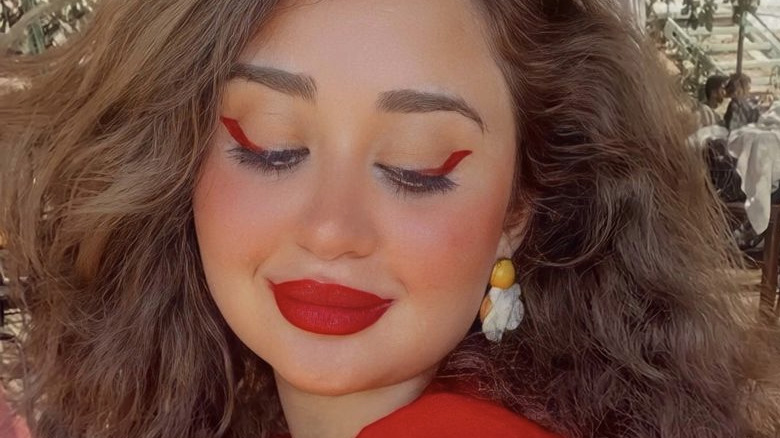 person with red makeup