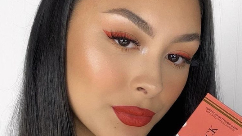 woman wearing red makeup