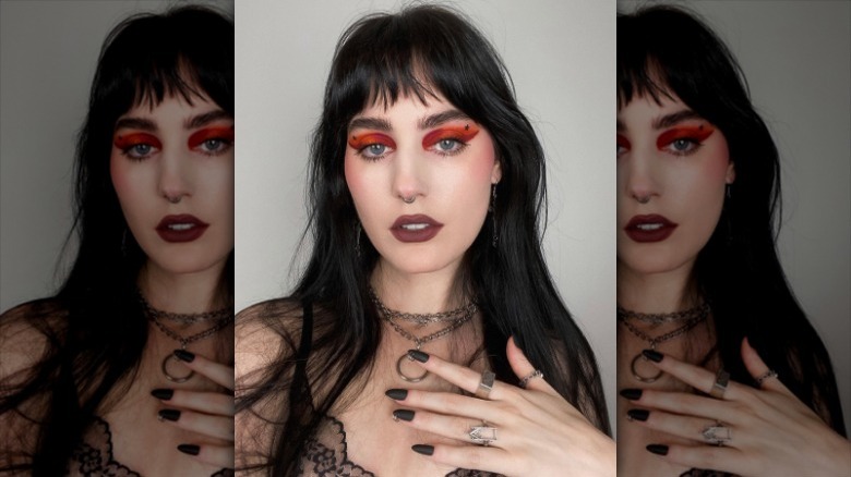 Red eyeshadow and dark lipstick