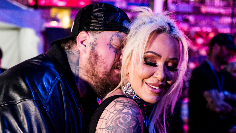 Jelly Roll kissing Bunnie Xo's neck