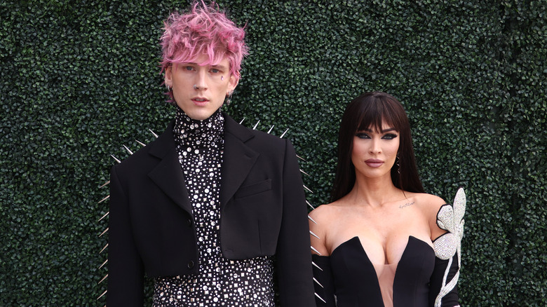 Machine Gun Kelly Megan Fox green backdrop