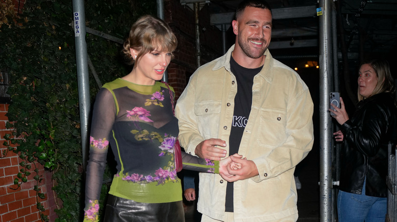 Travis Kelce and Taylor Swift smiling together
