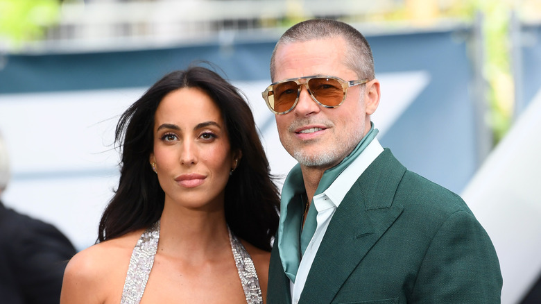 Ines de Ramon and Brad Pitt posing