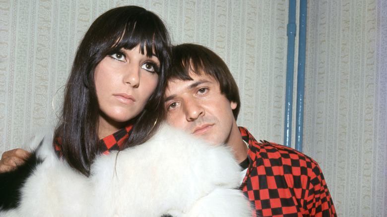 Sonny Bono leaning on Cher