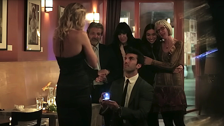 Justin Baldoni proposing to his wife, Emily.