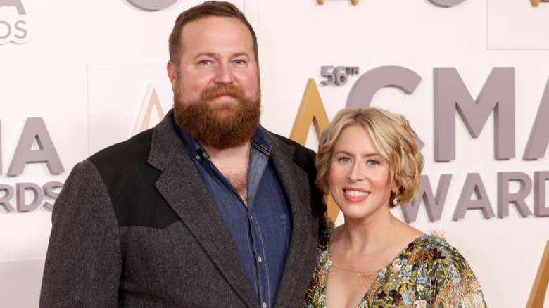 Ben and Erin Napier smile for photos on the CMA Awards red carpet